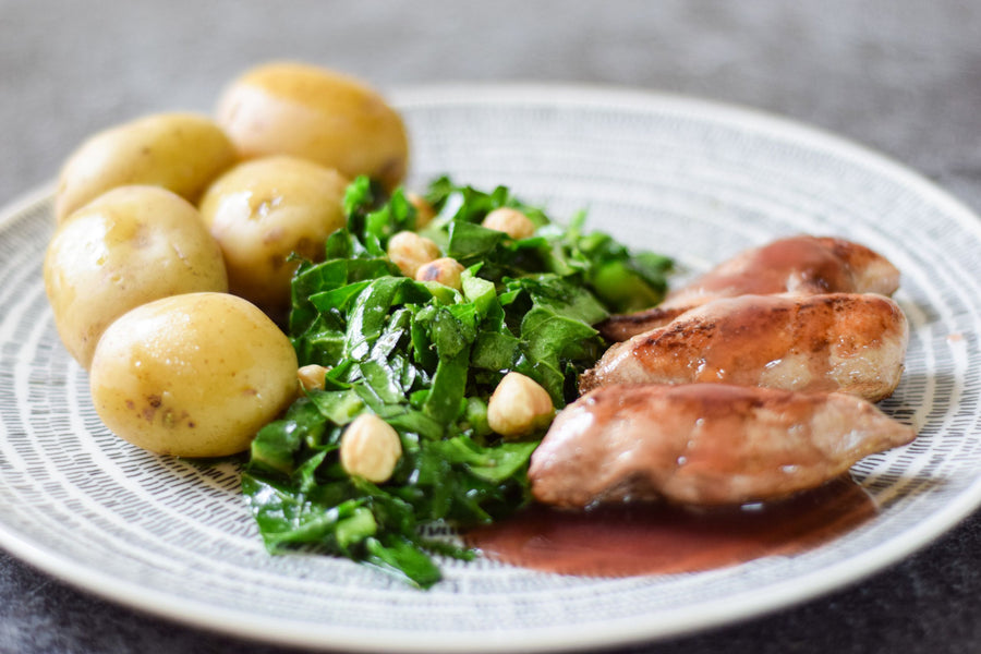 Pan-fried partridge breasts with stir-fried greens and hedgerow sauce